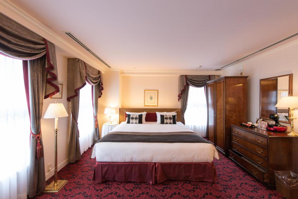 Postel nebo postele na pokoji v ubytování Kobe Kitano Hotel