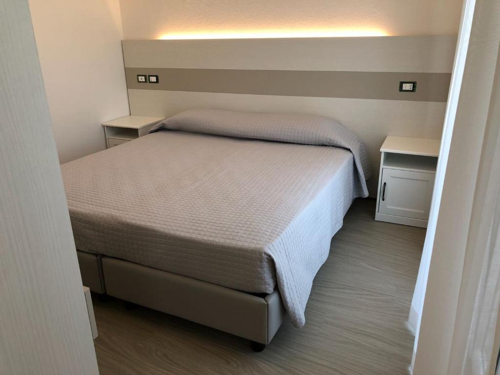 Postel nebo postele na pokoji v ubytování Hotel Portofino