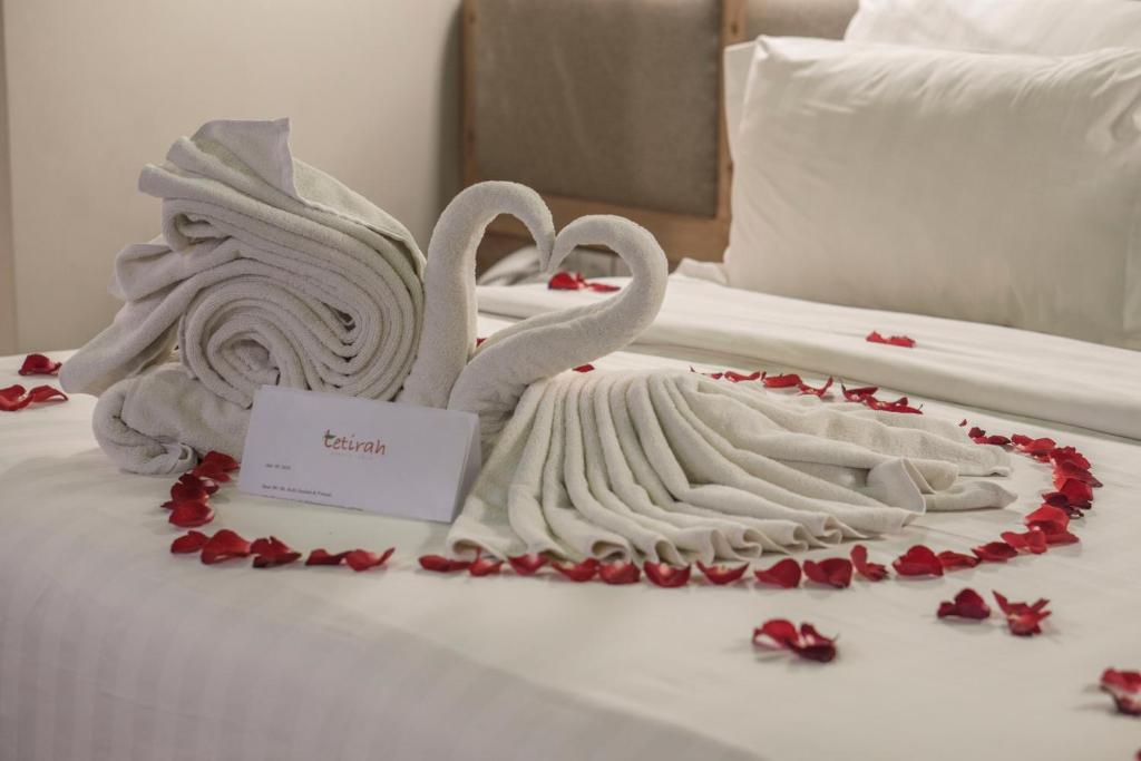 Postel nebo postele na pokoji v ubytování Tetirah Boutique Hotel