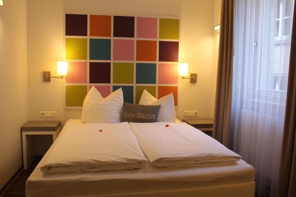 Ένα ή περισσότερα κρεβάτια σε δωμάτιο στο Altstadthotel Baunachshof