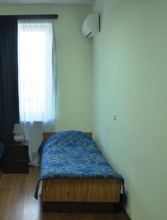 Postel nebo postele na pokoji v ubytování Guest House Dedoplisa