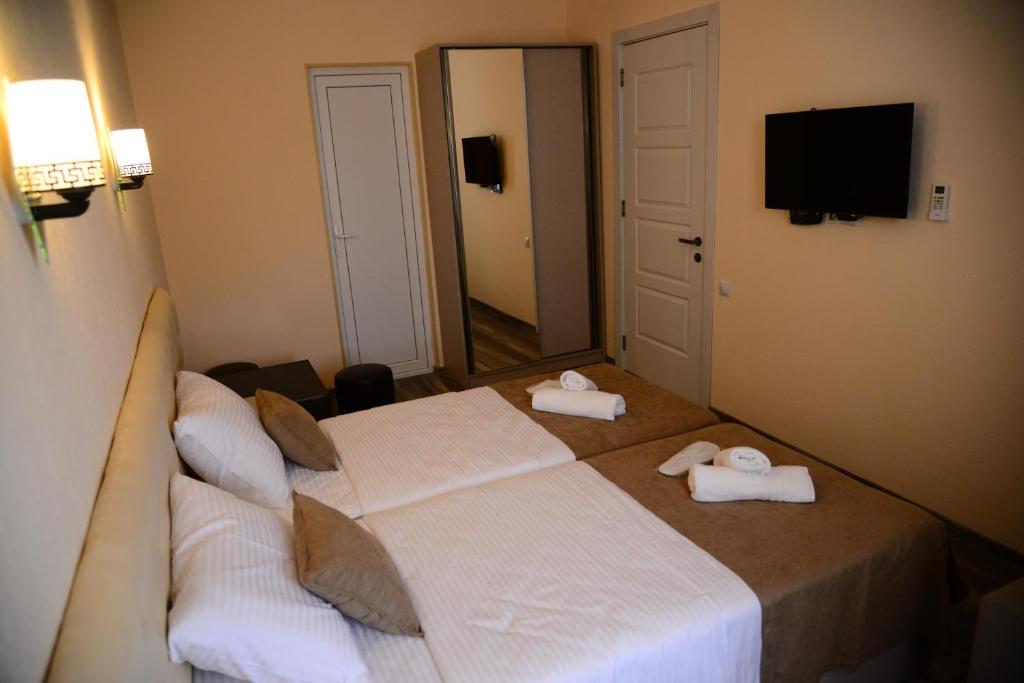 Postel nebo postele na pokoji v ubytování Hotel New Avlabari