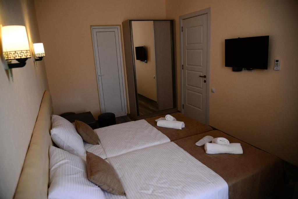 Postel nebo postele na pokoji v ubytování Hotel New Avlabari