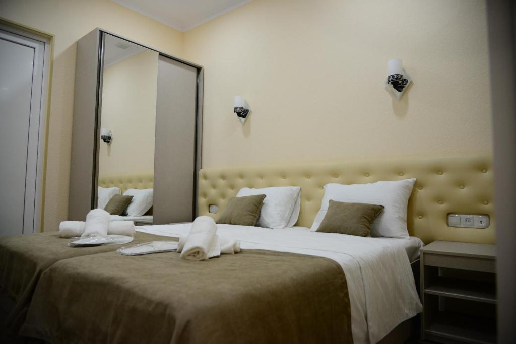 Postel nebo postele na pokoji v ubytování Hotel New Avlabari