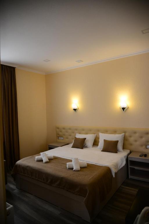 Postel nebo postele na pokoji v ubytování Hotel New Avlabari