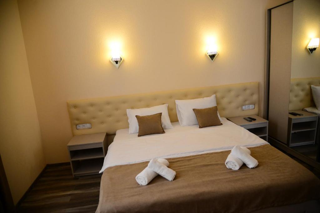Postel nebo postele na pokoji v ubytování Hotel New Avlabari