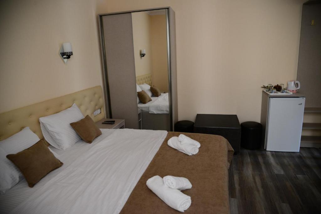 Postel nebo postele na pokoji v ubytování Hotel New Avlabari