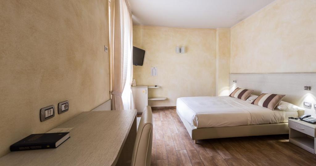 Postel nebo postele na pokoji v ubytování Agriturismo La Camilla