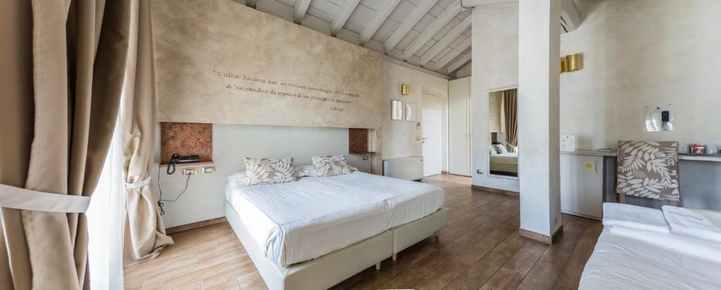 Postel nebo postele na pokoji v ubytování Agriturismo La Camilla