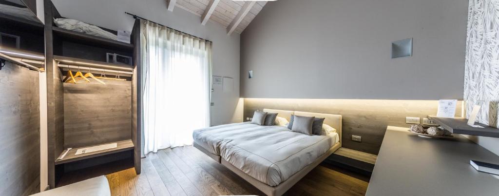 Postel nebo postele na pokoji v ubytování Agriturismo La Camilla