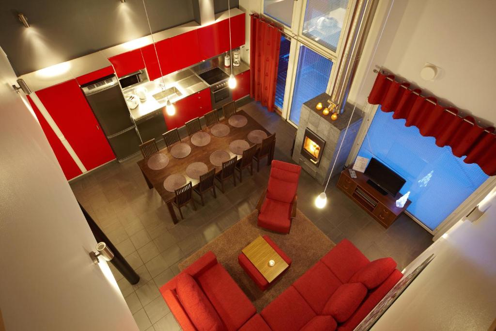 an overhead view of a dining room and kitchen with a table and chairs at Hyvärilä Holiday Apartments in Nurmes