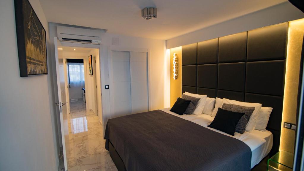 Posteľ alebo postele v izbe v ubytovaní Apartamentos Panorámicos Don Miguel II