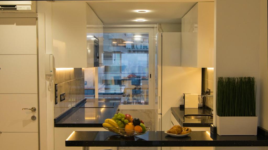 Kuchyňa alebo kuchynka v ubytovaní Apartamentos Panorámicos Don Miguel II