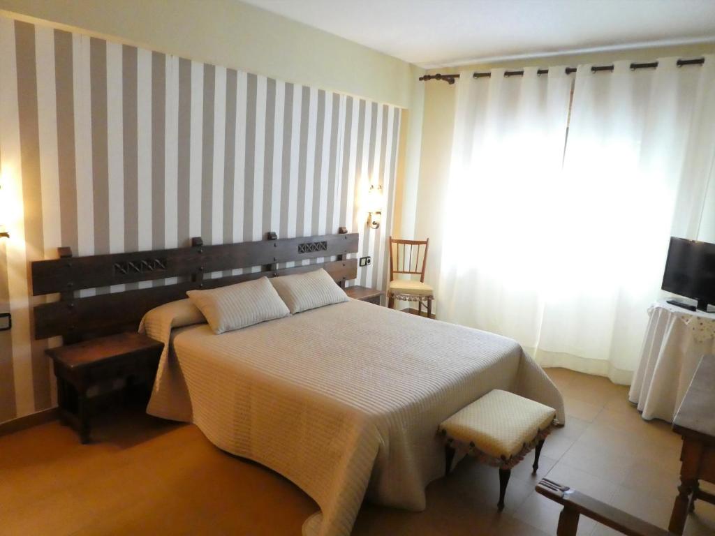 Postel nebo postele na pokoji v ubytování Hotel Barbacedo