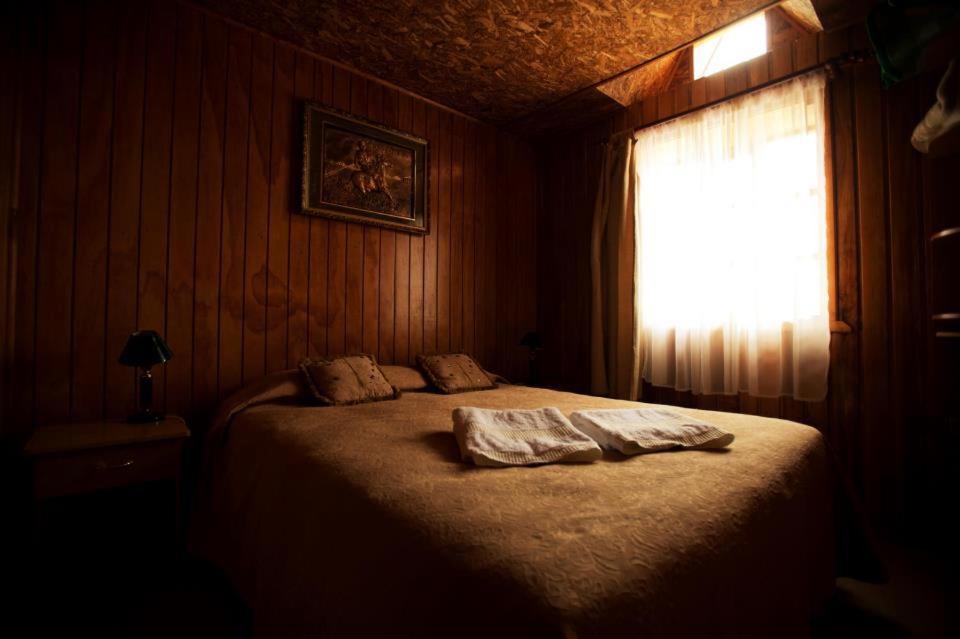 Postel nebo postele na pokoji v ubytování Hosteria Rayen