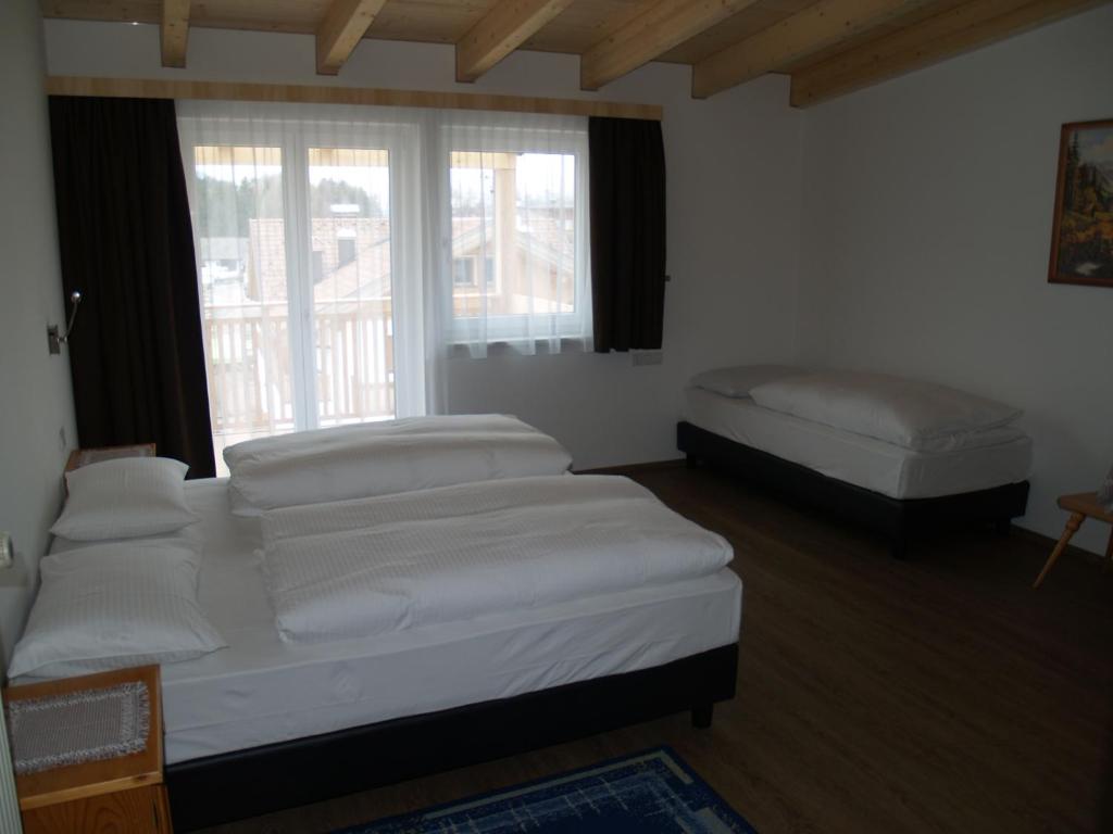 Postel nebo postele na pokoji v ubytování B&B Hotel Heidi