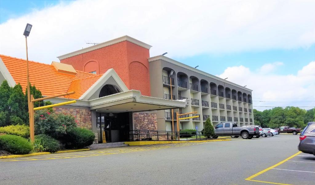 a large building with a clock on the front of it at Howard Johnson by Wyndham Clifton NJ in Clifton