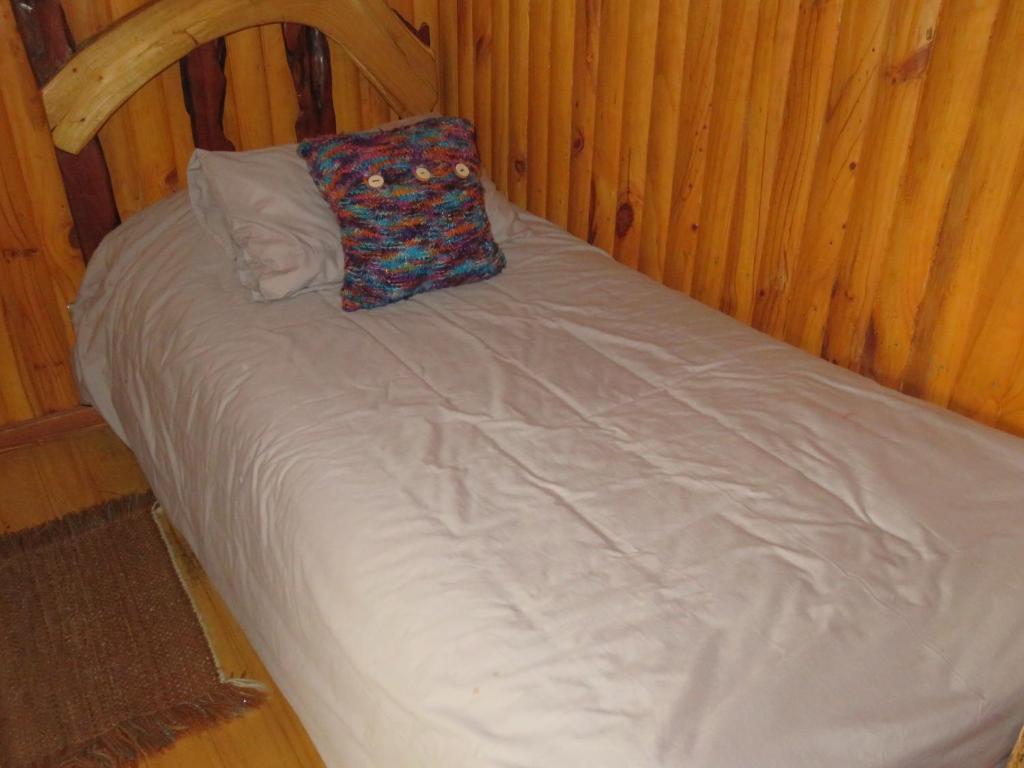 Postel nebo postele na pokoji v ubytování Cabañas Mis Viejos