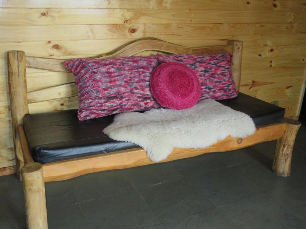 Postel nebo postele na pokoji v ubytování Cabañas Mis Viejos