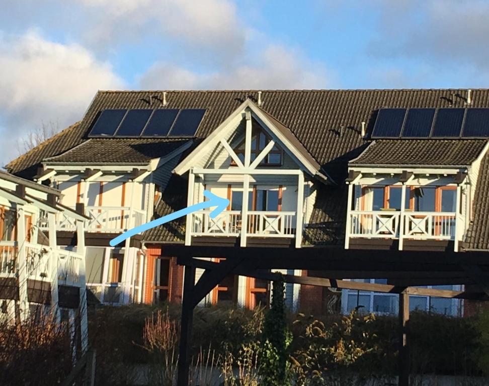 a house with solar panels on the roof at Maisonette "Abendröte"**** mit SEEBLICK in Ostseebad Sellin