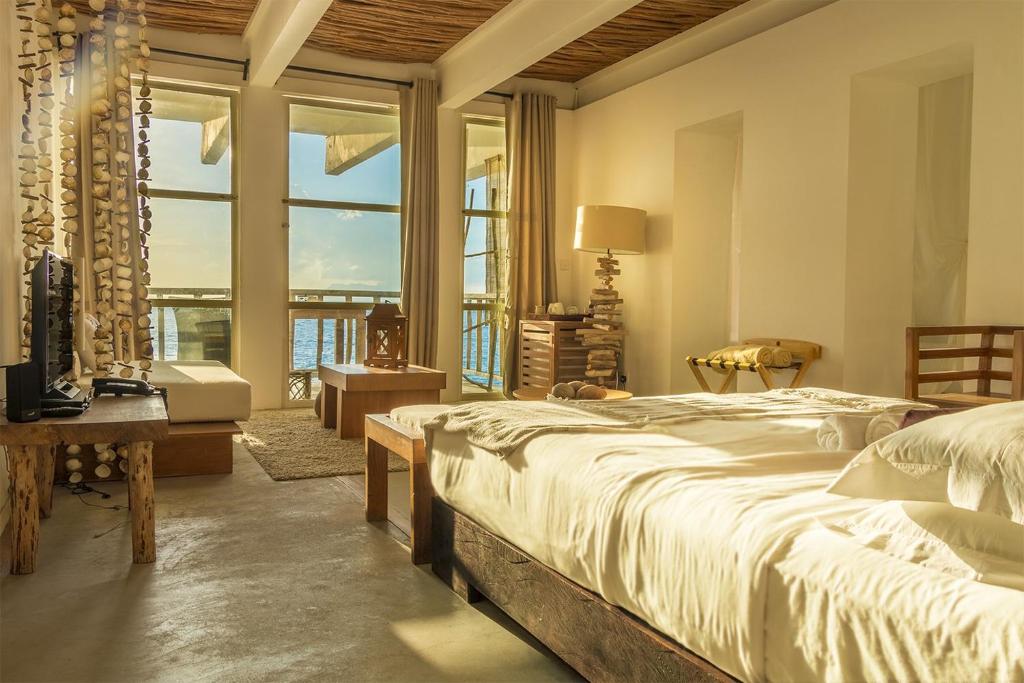 Postel nebo postele na pokoji v ubytování Bliss Boutique Hotel Seychelles