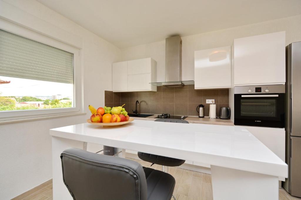 Kuchyňa alebo kuchynka v ubytovaní Apartment Pan