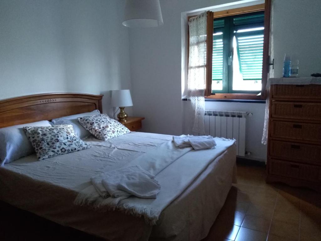 Postel nebo postele na pokoji v ubytování Cà du Frà