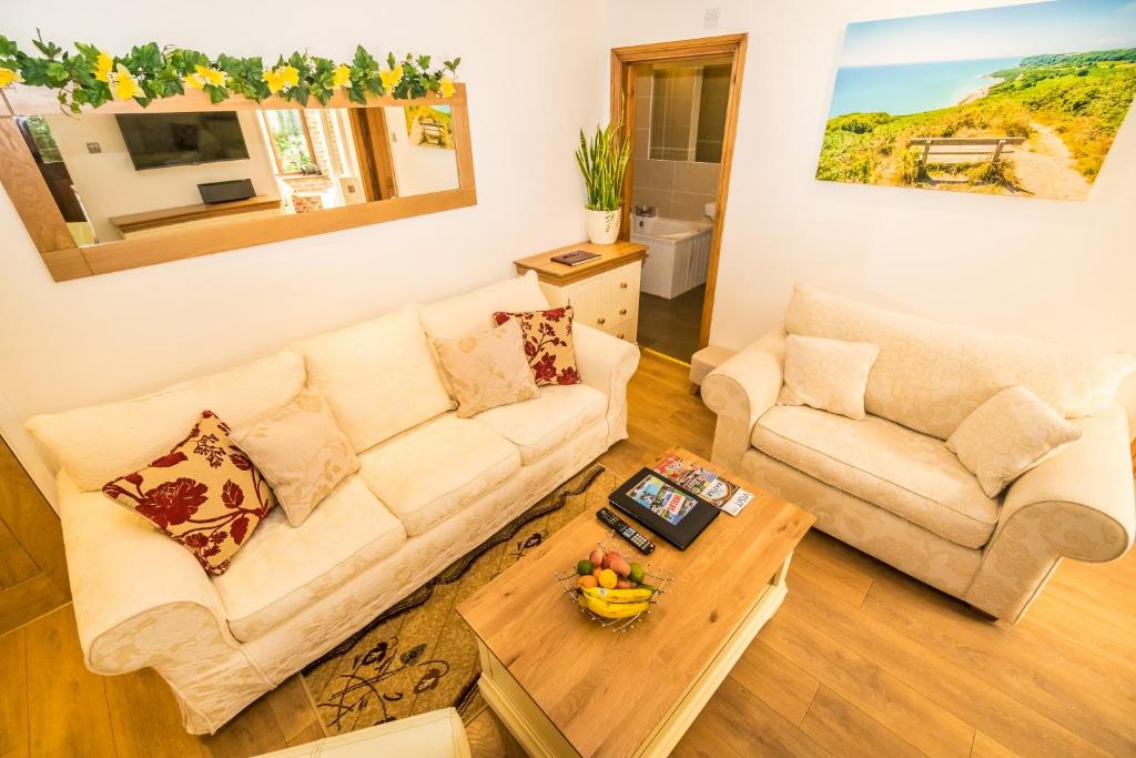 Posezení v ubytování Badgers Den - Covehurst Bay Holiday Cottage