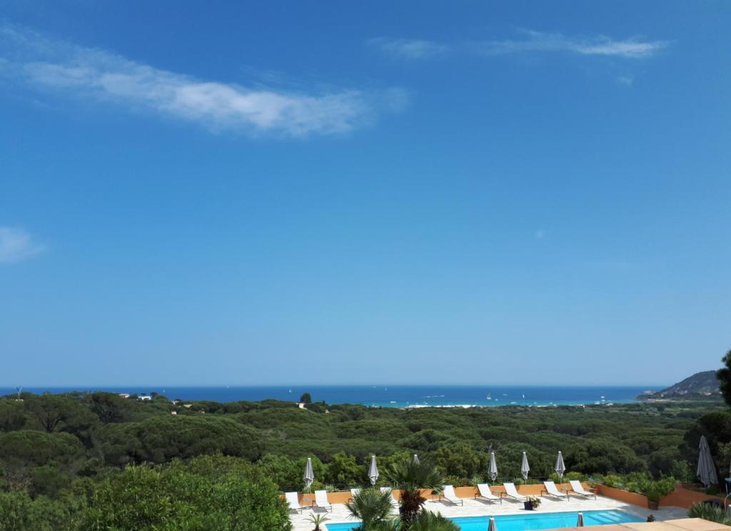 a view of the resort from the pool at Hôtel les Bouis - Vue mer in Saint-Tropez