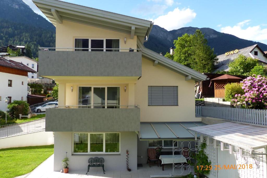 a view of a house with a balcony at Haus am Bach in Fulpmes