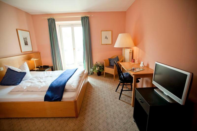 Postel nebo postele na pokoji v ubytování Altstadthotel Bad Griesbach