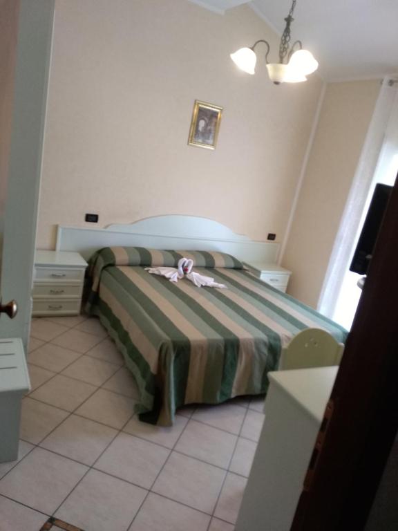Łóżko lub łóżka w pokoju w obiekcie Hotel Grazia Ristorante