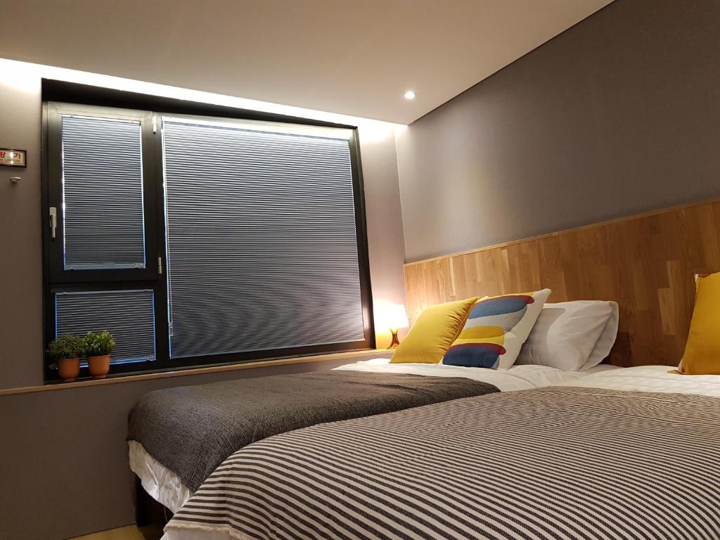 Cama ou camas em um quarto em Hostel CLEO Seoul Hongdae