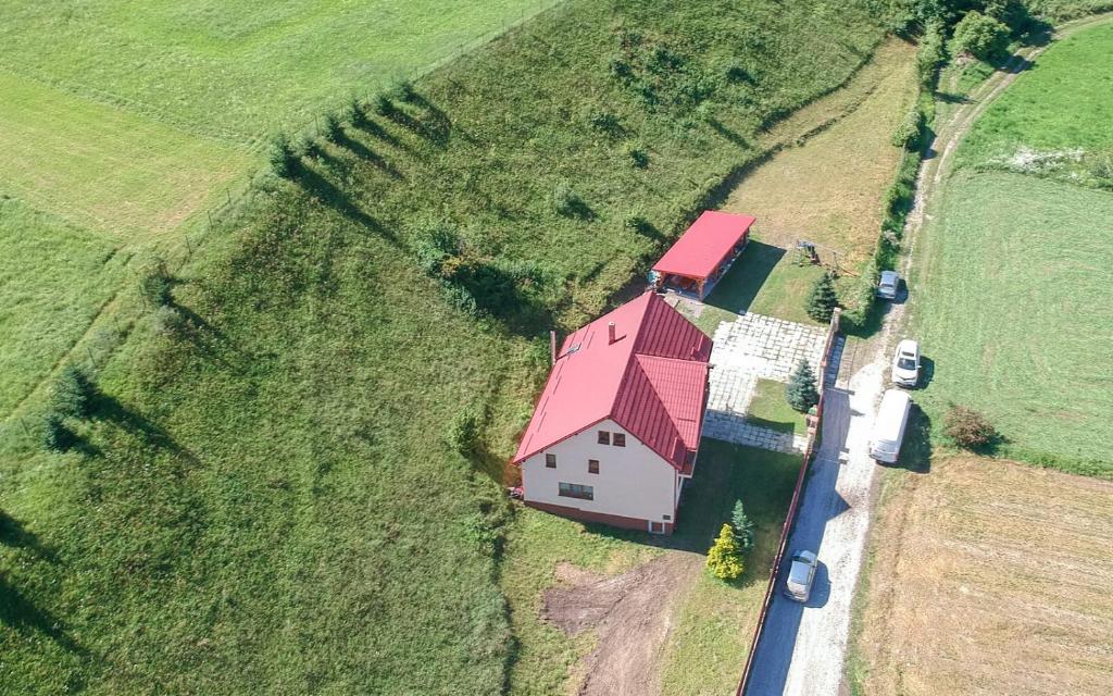an aerial view of a house with a red roof at Casa Din Gradina Lui Ioan in Tărlungeni