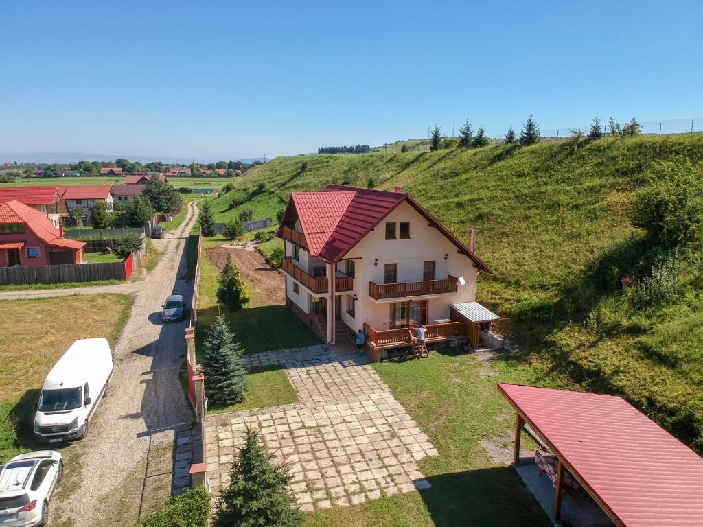 an aerial view of a house on a hill at Casa Din Gradina Lui Ioan in Tărlungeni