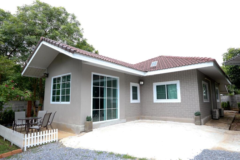 a small house with a patio in front of it at Relax @ Khao Yai in Ban Khanong Phra Klang (1)