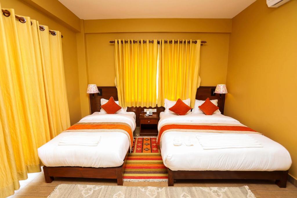 Ένα ή περισσότερα κρεβάτια σε δωμάτιο στο Hotel The Clock