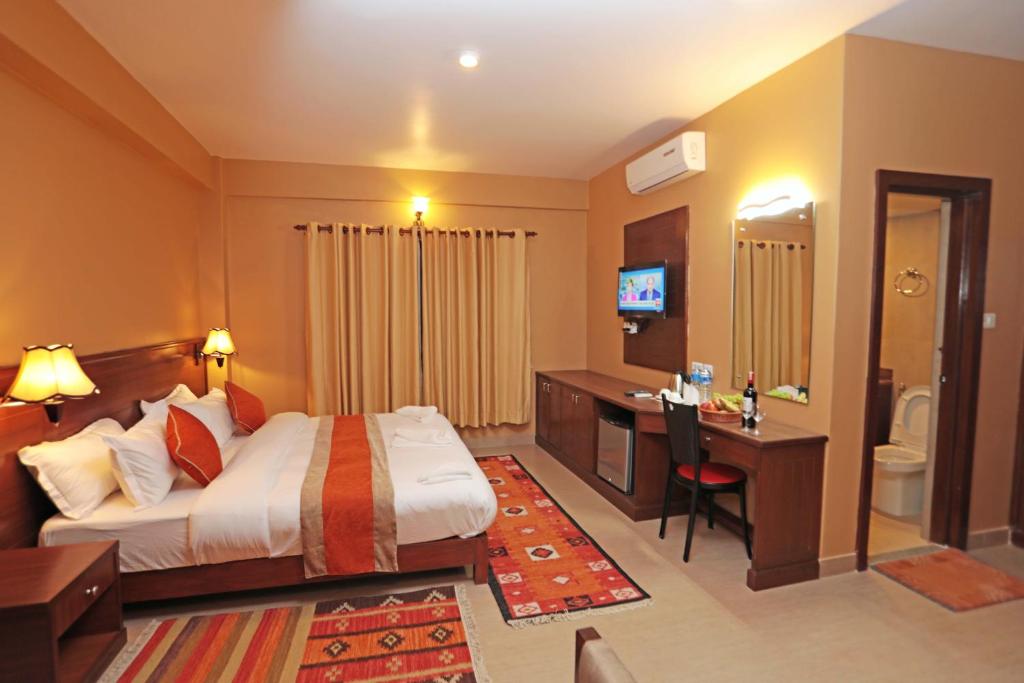 Ένα ή περισσότερα κρεβάτια σε δωμάτιο στο Hotel The Clock