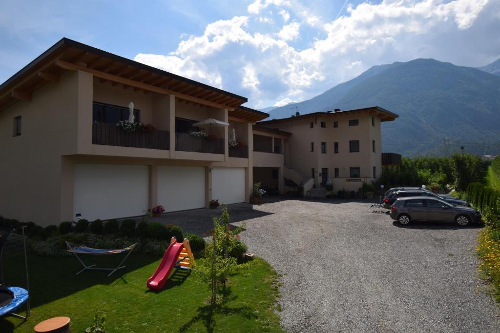 a house with a car parked in a driveway at Garnhof in Coldrano