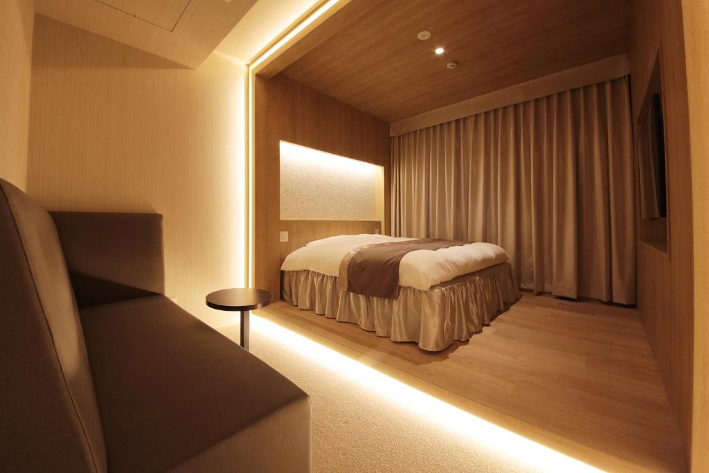 Postel nebo postele na pokoji v ubytování N Hotel