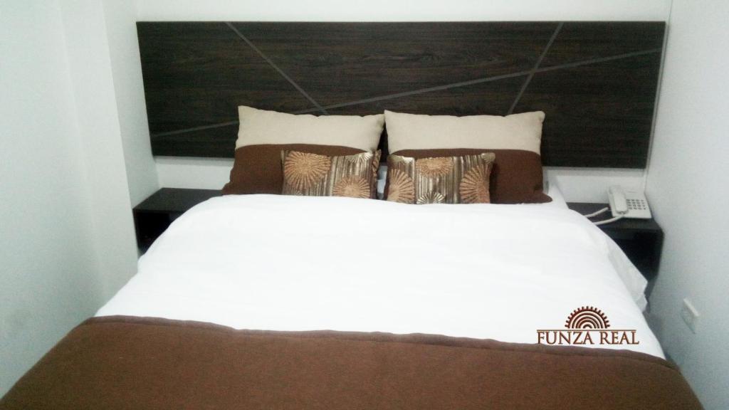 Postel nebo postele na pokoji v ubytování Hotel Funza Real