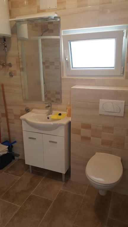 Kúpeľňa v ubytovaní Apartments Delfin