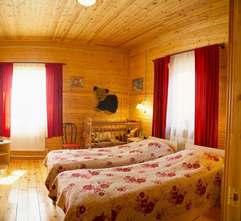 Voodi või voodid majutusasutuse Vladimirskiy Hutorok toas