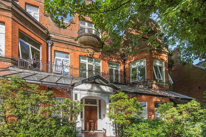 a large brick building with balconies on top of it at Hampstead Stylish Apartment Brilliant Location in London