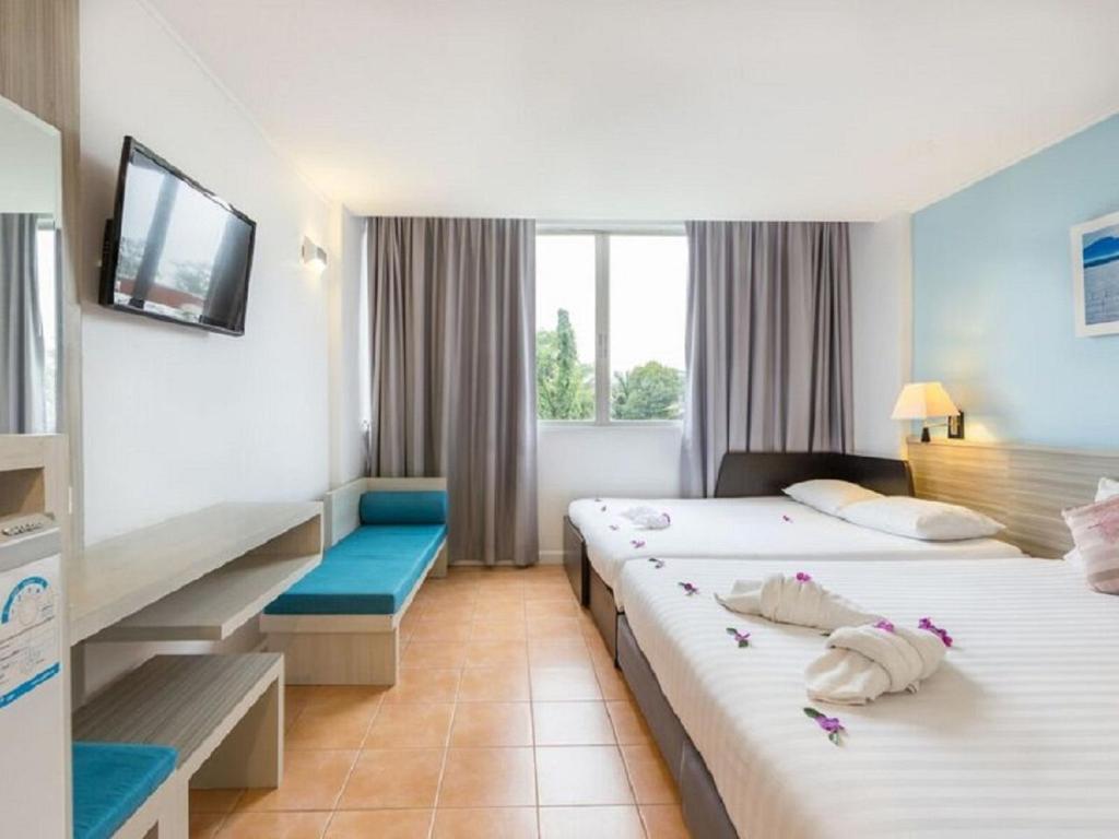 Postel nebo postele na pokoji v ubytování ON Hotel Phuket - SHA