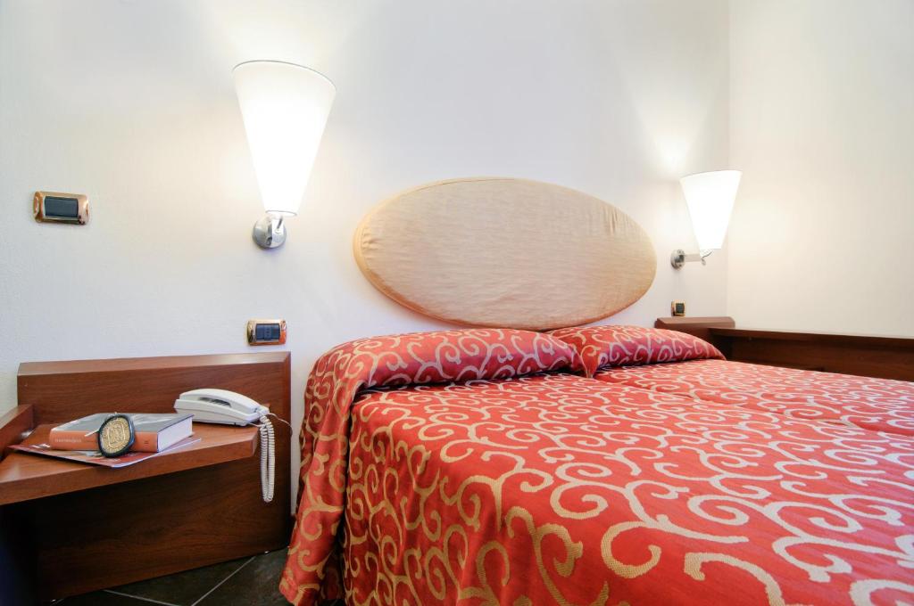 Posteľ alebo postele v izbe v ubytovaní Antico Albergo Madonna