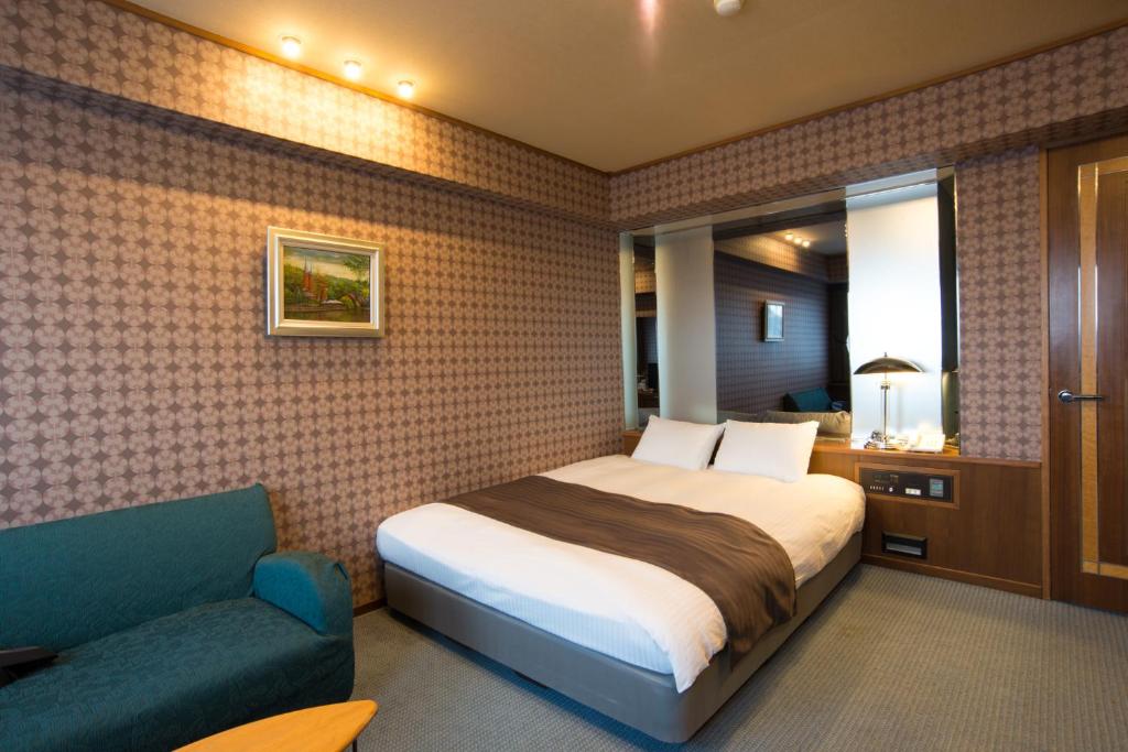 Postel nebo postele na pokoji v ubytování Hotel Suncrest