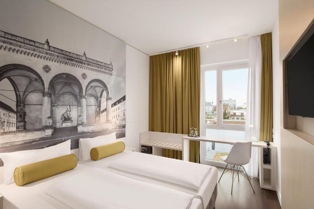 a bedroom with a bed and a desk and a television at Super 8 by Wyndham Munich City North in Munich