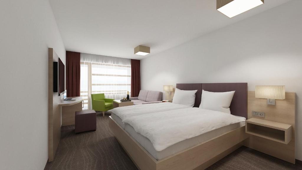 Postel nebo postele na pokoji v ubytování all inclusive Hotel Lohmann