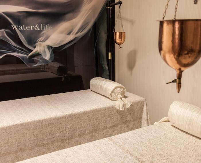 A bed or beds in a room at Gran Hotel Nagari Boutique & Spa